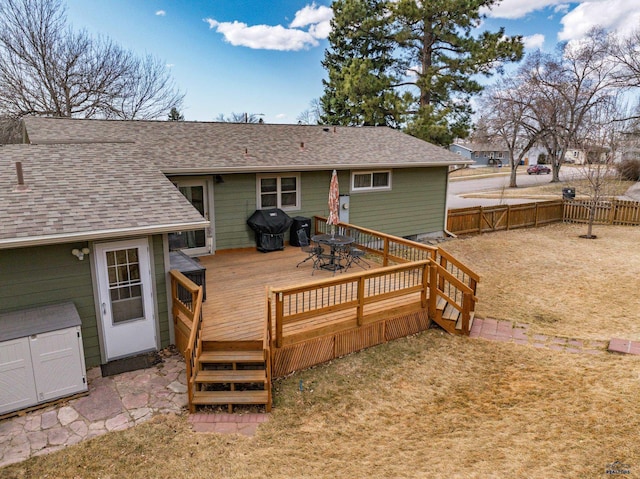 2204 Cruz Dr, Rapid City, SD 57702 - wooden deck with outdoor dining area and fence