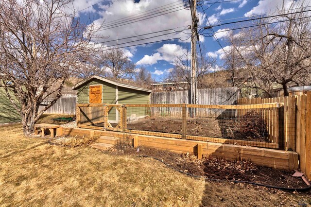 2204 Cruz Dr, Rapid City, SD 57702 - view of yard with an outdoor structure and fence