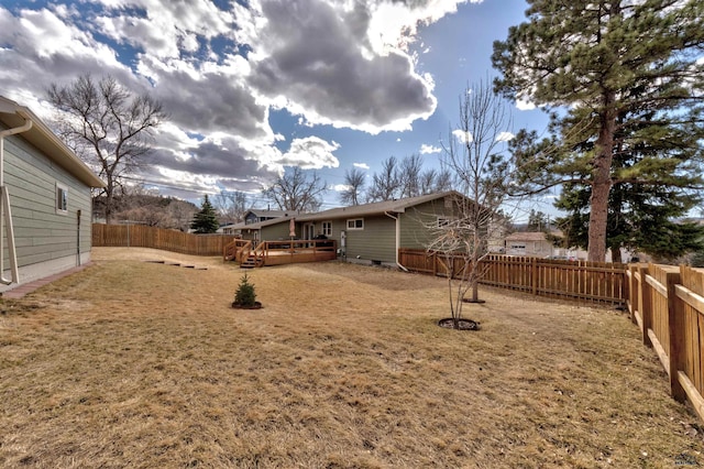 2204 Cruz Dr, Rapid City, SD 57702 - view of yard with a wooden deck and a fenced backyard