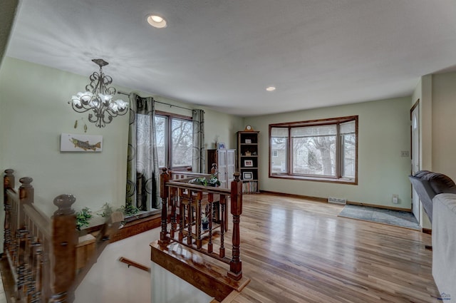 2204 Cruz Dr, Rapid City, SD 57702 - dining space with visible vents, baseboards, a chandelier, recessed lighting, and wood finished floors
