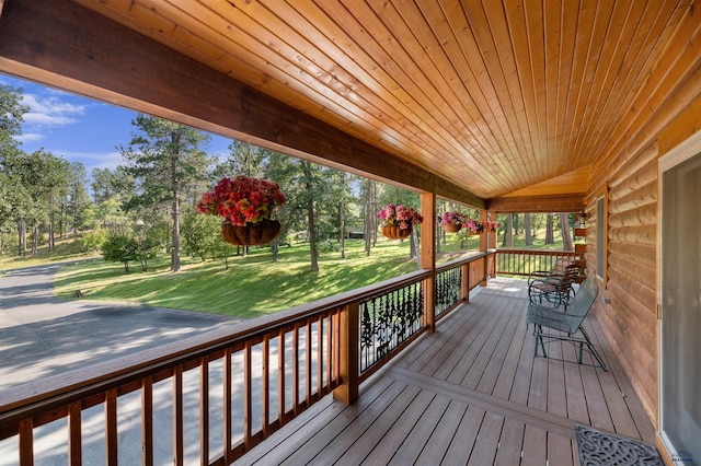 deck featuring a lawn and a porch