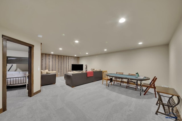 living area with recessed lighting, baseboards, and carpet