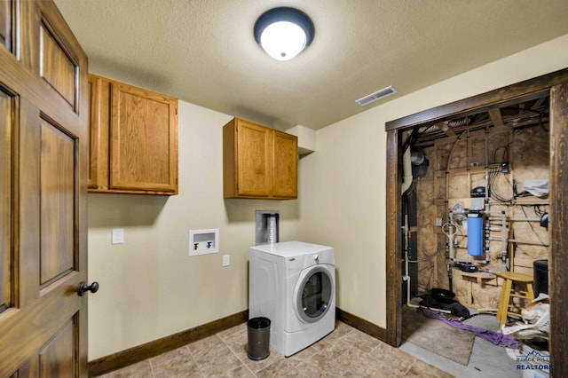 laundry area with washer / clothes dryer, cabinet space, visible vents, and a textured ceiling