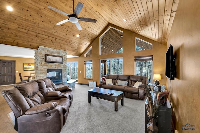 living room featuring a stone fireplace, wooden ceiling, high vaulted ceiling, and ceiling fan