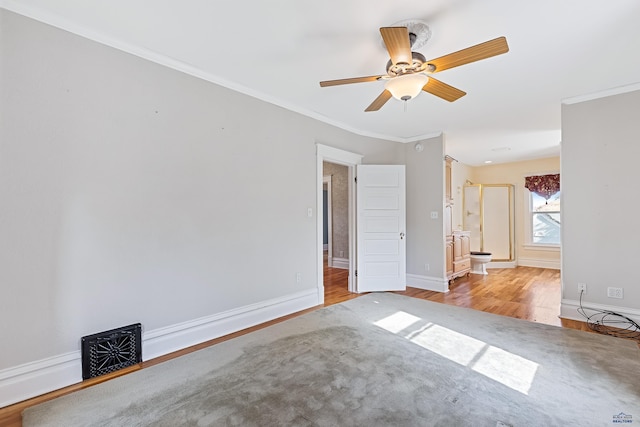 1120 W Blvd, Rapid City, SD 57701 - empty room featuring visible vents, ornamental molding, light wood-style flooring, baseboards, and ceiling fan