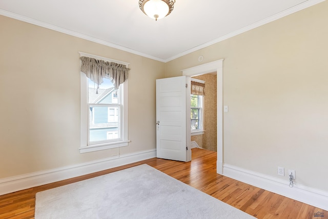 1120 W Blvd, Rapid City, SD 57701 - spare room with plenty of natural light, wood finished floors, and ornamental molding