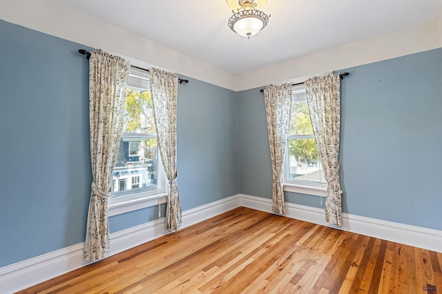 1120 W Blvd, Rapid City, SD 57701 - unfurnished room with baseboards and wood finished floors