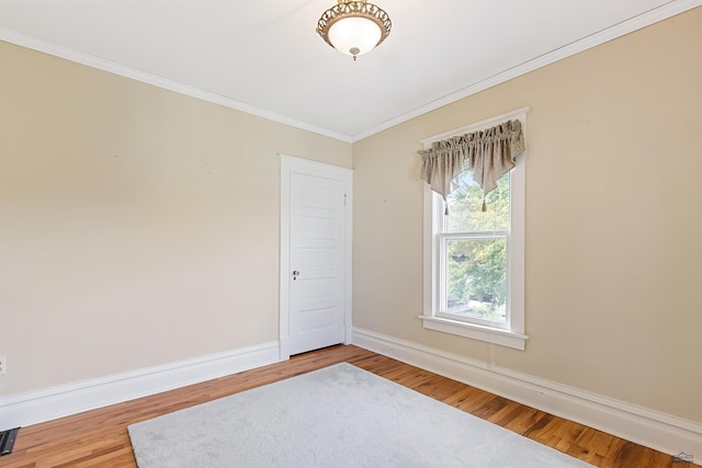 1120 W Blvd, Rapid City, SD 57701 - empty room featuring baseboards, wood finished floors, and crown molding