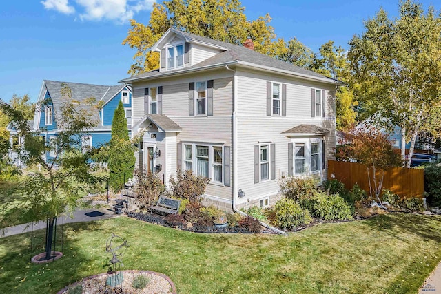 1120 W Blvd, Rapid City, SD 57701 - view of front of house with a front lawn, fence, and roof with shingles