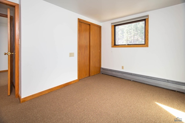 1515 Forest Dr, Rapid City, SD 57701 - unfurnished room featuring baseboards, carpet floors, and baseboard heating