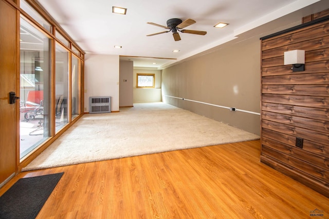 1515 Forest Dr, Rapid City, SD 57701 - unfurnished living room featuring heating unit, a ceiling fan, and wood finished floors