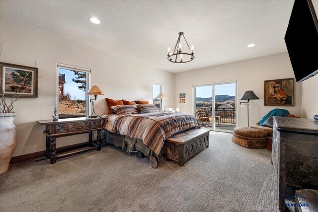 carpeted bedroom with recessed lighting, baseboards, a notable chandelier, and access to outside