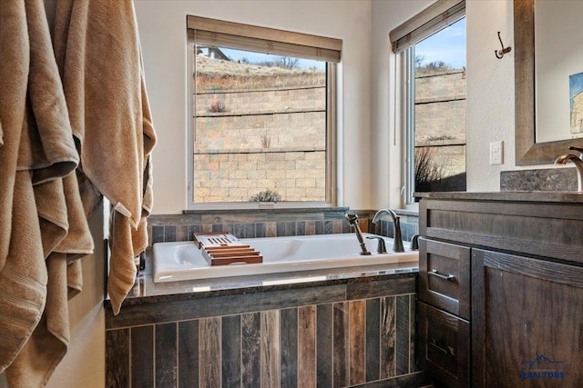 full bath featuring a bath and vanity
