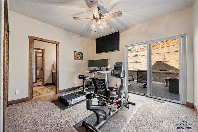 workout room with visible vents, baseboards, carpet, and ceiling fan