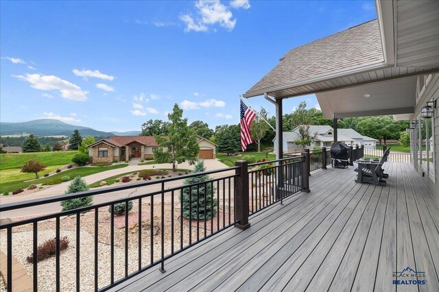 wooden terrace with a mountain view