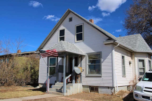 920 Haines Ave, Rapid City, SD 57701 - view of front of property with roof with shingles, a chimney, and entry steps