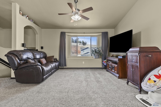 carpeted living area featuring lofted ceiling and ceiling fan