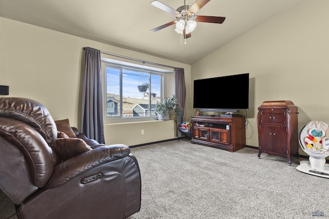 carpeted living area with baseboards, a ceiling fan, and vaulted ceiling