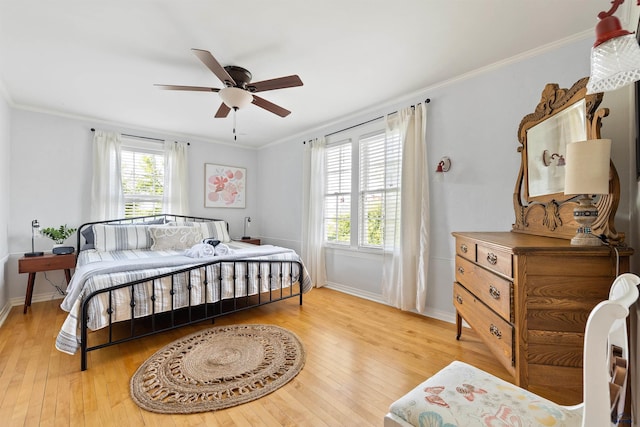 1000 W Blvd, Rapid City, SD 57701 - bedroom featuring baseboards, ceiling fan, crown molding, and hardwood / wood-style flooring