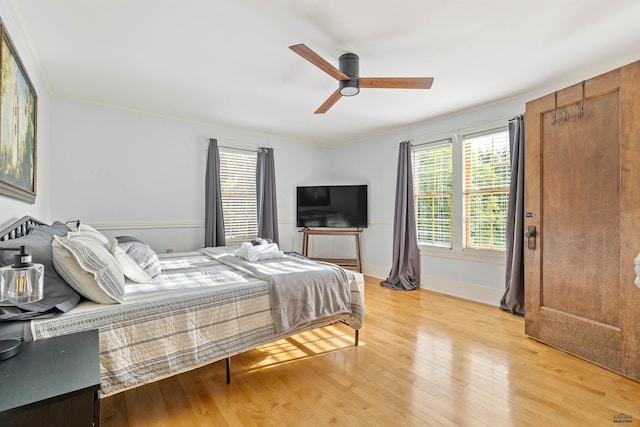 1000 W Blvd, Rapid City, SD 57701 - bedroom with a ceiling fan, light wood-style floors, and baseboards