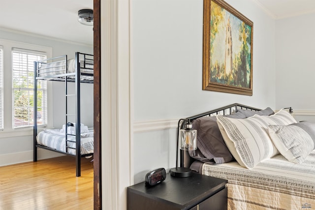 1000 W Blvd, Rapid City, SD 57701 - bedroom featuring wood finished floors, baseboards, and ornamental molding