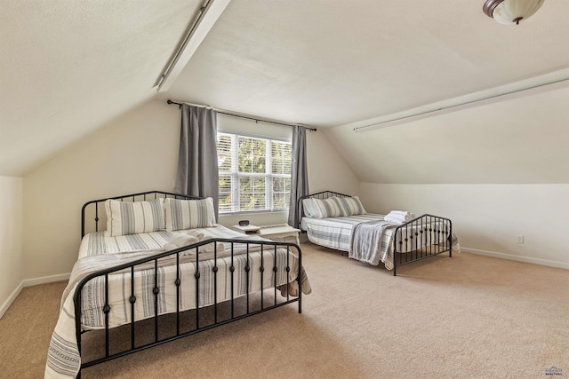 1000 W Blvd, Rapid City, SD 57701 - carpeted bedroom with vaulted ceiling and baseboards