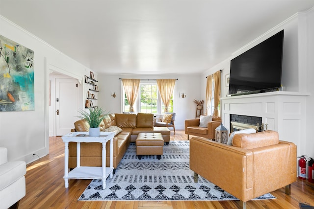 1000 W Blvd, Rapid City, SD 57701 - living area with ornamental molding, a fireplace, baseboards, and wood finished floors