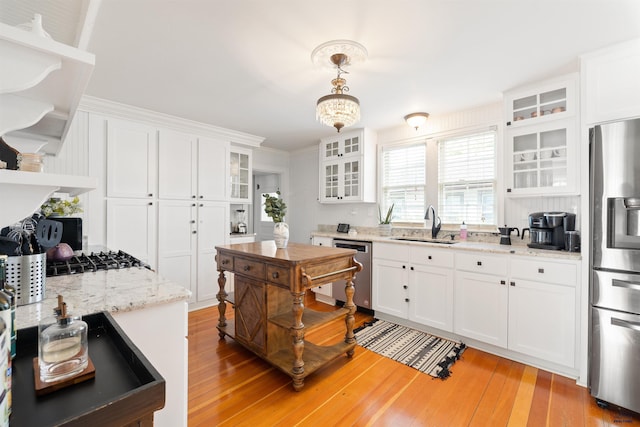 1000 W Blvd, Rapid City, SD 57701 - kitchen featuring open shelves, white cabinetry, appliances with stainless steel finishes, and a sink