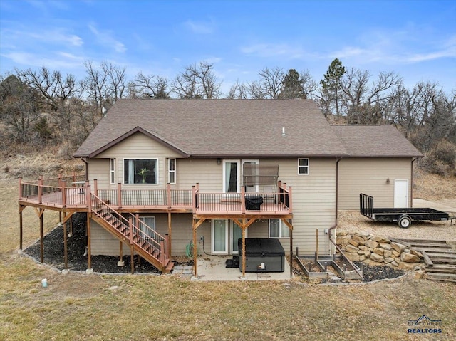 19329 US Highway 85, Belle Fourche, SD 57717 - rear view of property with a hot tub, stairs, a shingled roof, and a wooden deck
