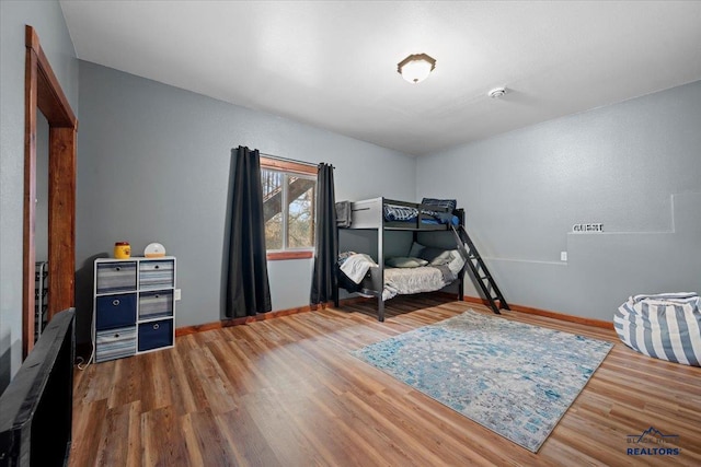 19329 US Highway 85, Belle Fourche, SD 57717 - bedroom featuring baseboards and wood finished floors