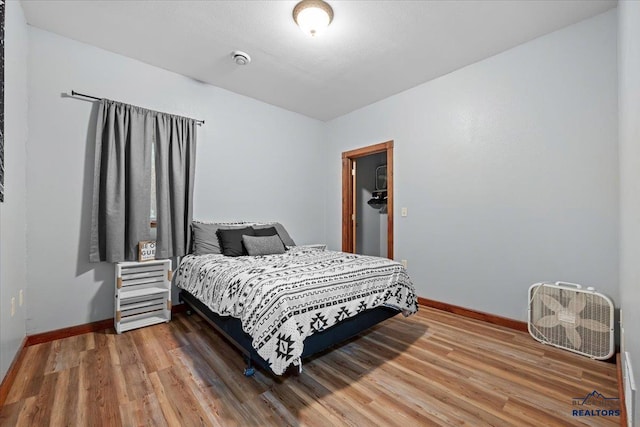 19329 US Highway 85, Belle Fourche, SD 57717 - bedroom with baseboards and wood finished floors