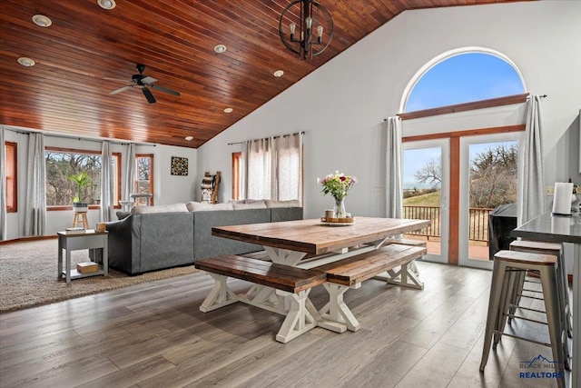 19329 US Highway 85, Belle Fourche, SD 57717 - dining space featuring wooden ceiling, high vaulted ceiling, wood finished floors, and ceiling fan with notable chandelier