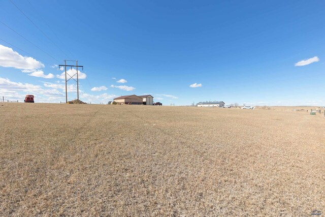 view of yard with a rural view