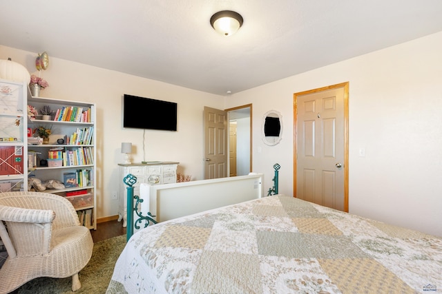 bedroom featuring wood finished floors