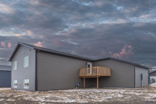rear view of house featuring a deck