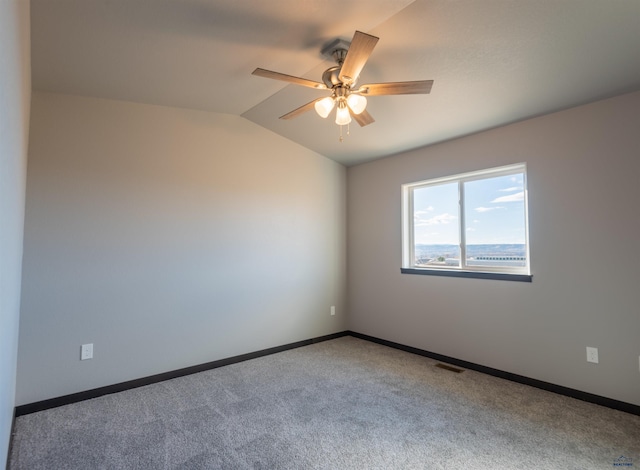unfurnished room featuring baseboards, visible vents, carpet flooring, and a ceiling fan