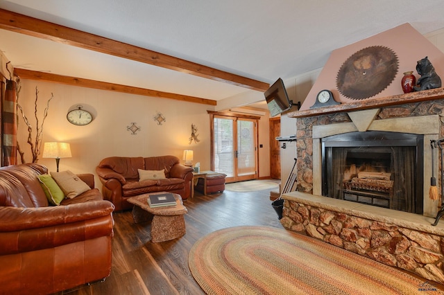 living area with a fireplace, wood finished floors, and beam ceiling