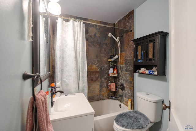 bathroom with vanity, toilet, and shower / tub combo