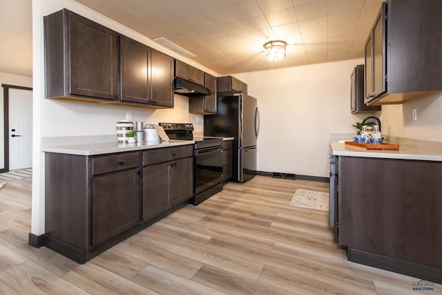 1920 Reservoir Rd, Rapid City, SD 57703 - kitchen featuring light countertops, dark brown cabinetry, under cabinet range hood, and black / electric stove