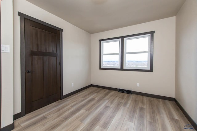 1920 Reservoir Rd, Rapid City, SD 57703 - spare room featuring baseboards, light wood-style floors, and visible vents