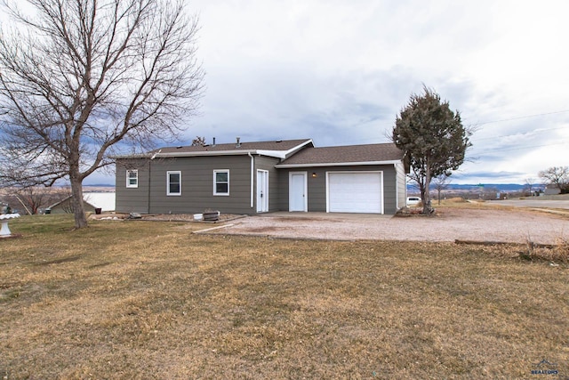 1920 Reservoir Rd, Rapid City, SD 57703 - single story home featuring a garage, a front lawn, and roof with shingles