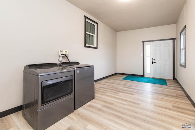 1920 Reservoir Rd, Rapid City, SD 57703 - laundry room with baseboards, independent washer and dryer, laundry area, and light wood finished floors