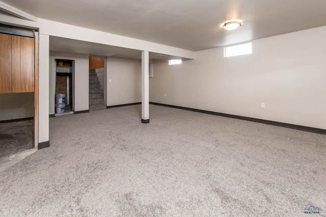 1920 Reservoir Rd, Rapid City, SD 57703 - below grade area with carpet, stairway, and baseboards