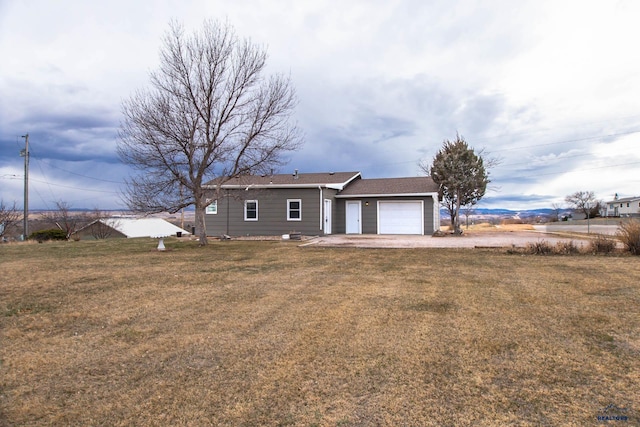1920 Reservoir Rd, Rapid City, SD 57703 - ranch-style home featuring driveway, a front lawn, and an attached garage