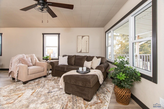 1920 Reservoir Rd, Rapid City, SD 57703 - living area featuring baseboards, ceiling fan, and wood finished floors