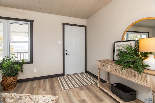 1920 Reservoir Rd, Rapid City, SD 57703 - entryway with baseboards, ornamental molding, and wood finished floors