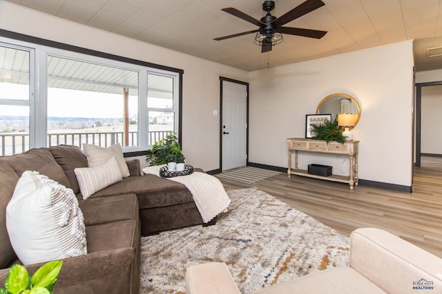 1920 Reservoir Rd, Rapid City, SD 57703 - living room featuring baseboards, ceiling fan, and wood finished floors