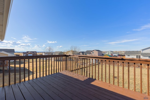 wooden deck with a residential view