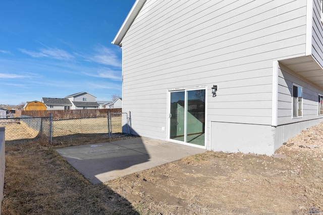 back of house with fence and a patio area