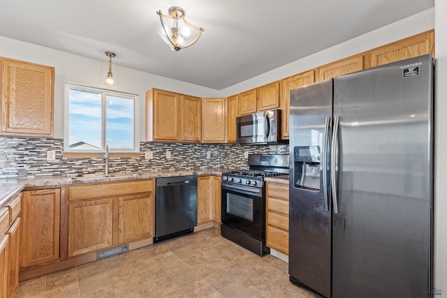 kitchen with a sink, visible vents, decorative backsplash, and appliances with stainless steel finishes